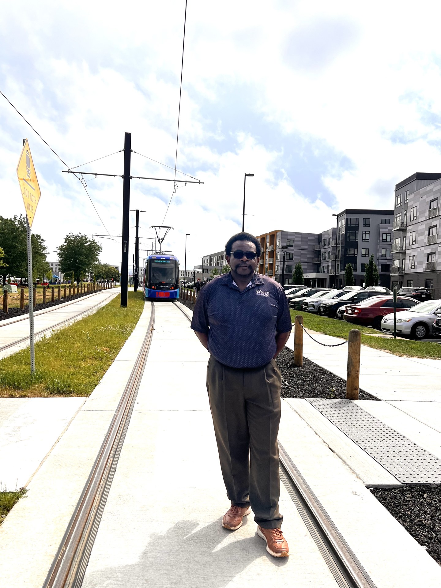 Guest standing beside the streetcar platform