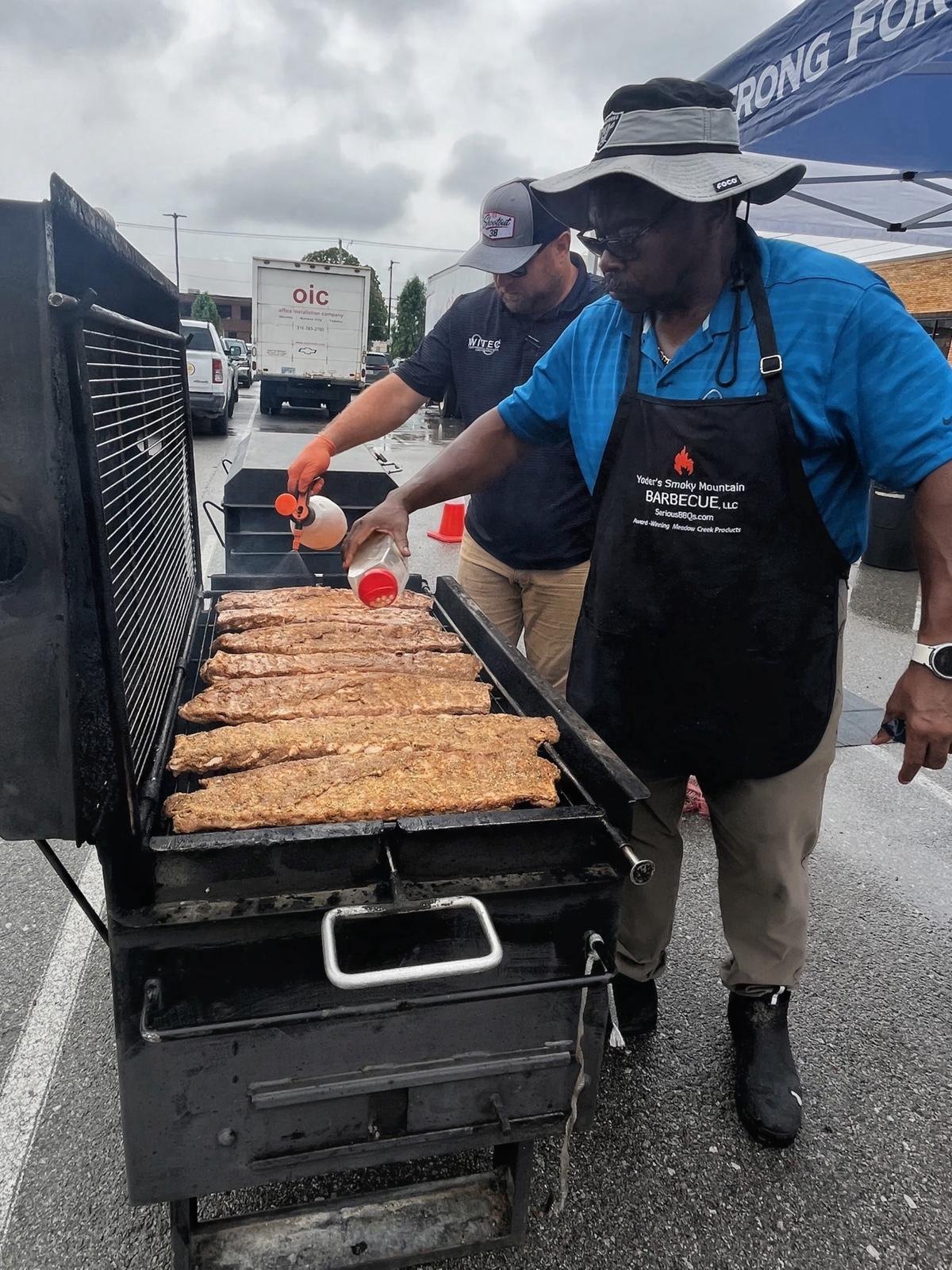 Volunteers sharing food at the cookout