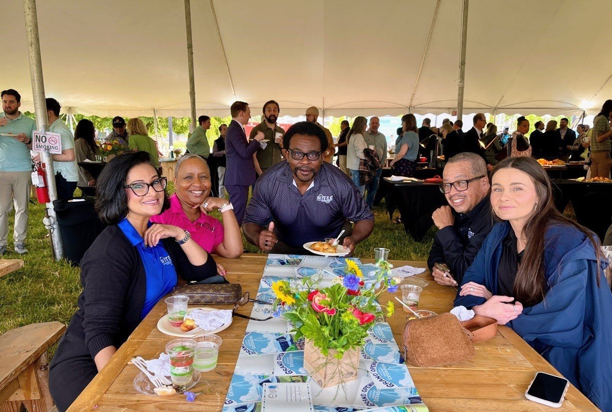 Guests sharing a table at the opening celebration