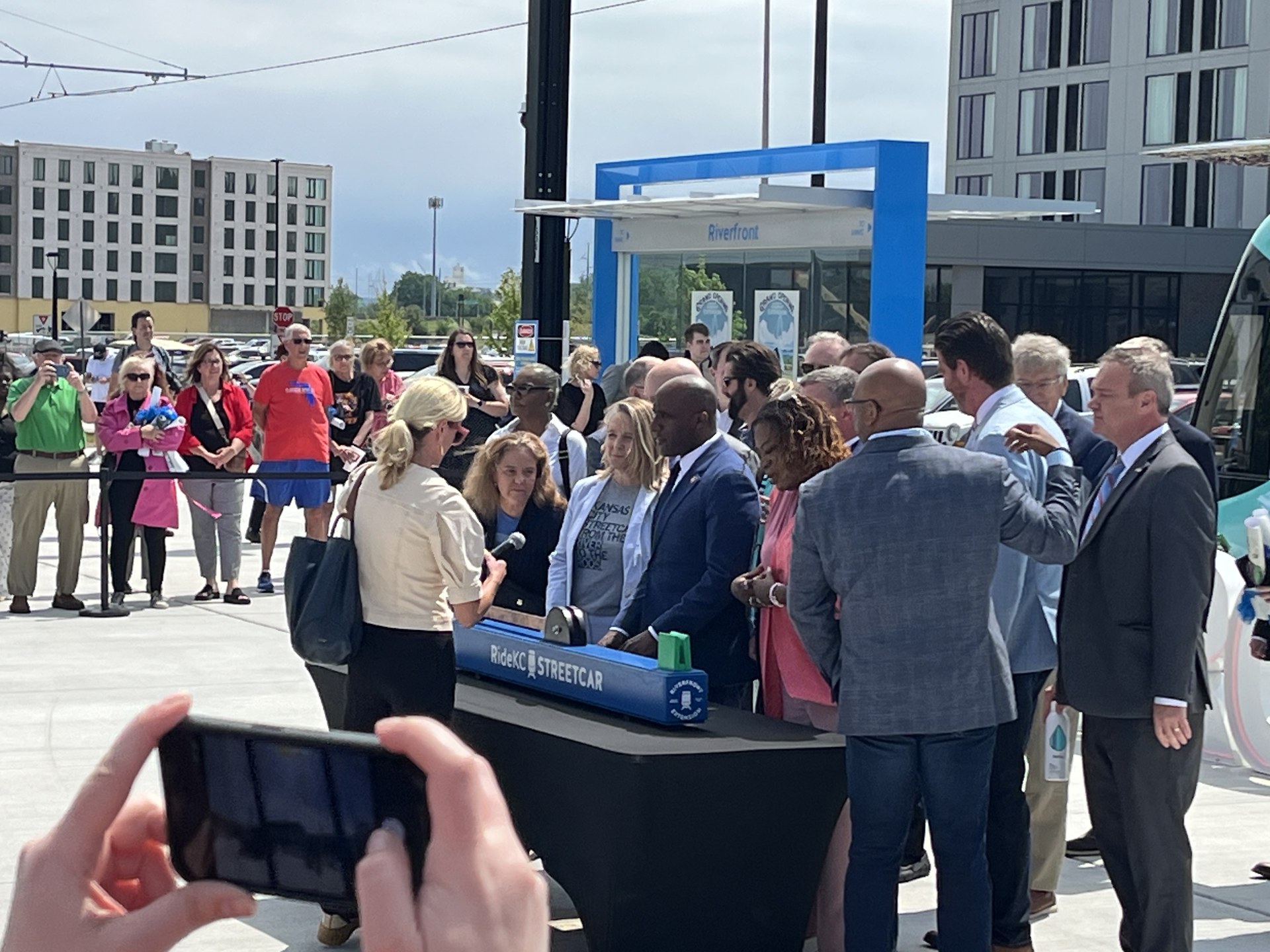 Guests gathered around the KC Streetcar ribbon-cutting table