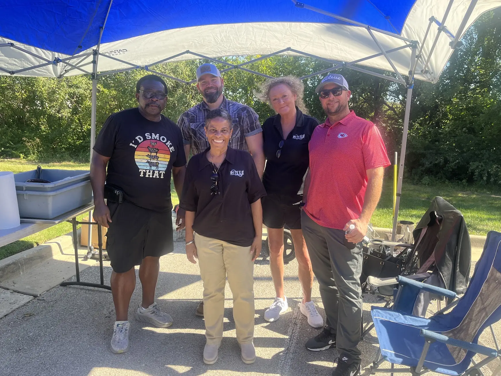 WITEC team members together under a tent at the rib competition