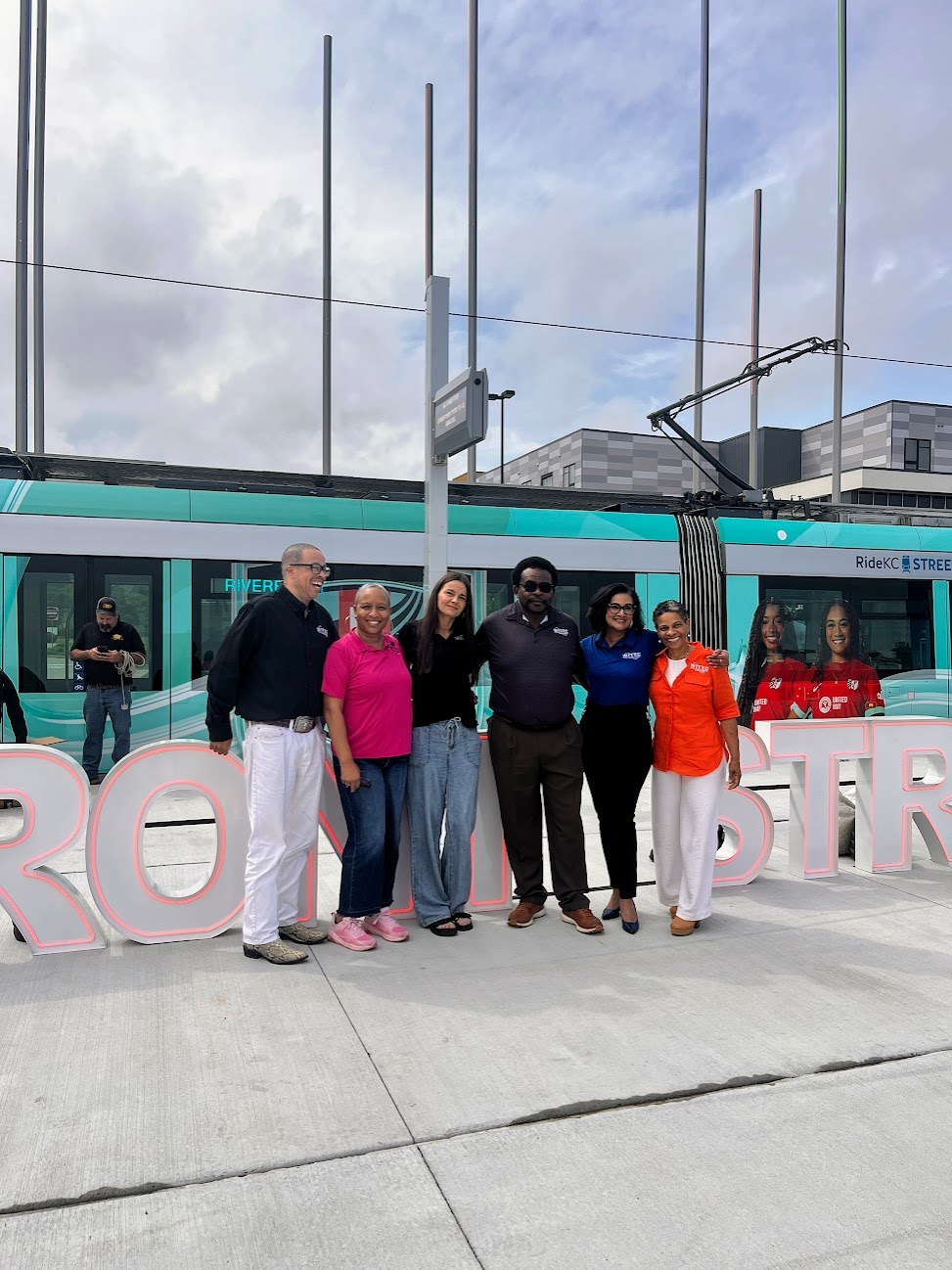 Group photo beside the streetcar opening display