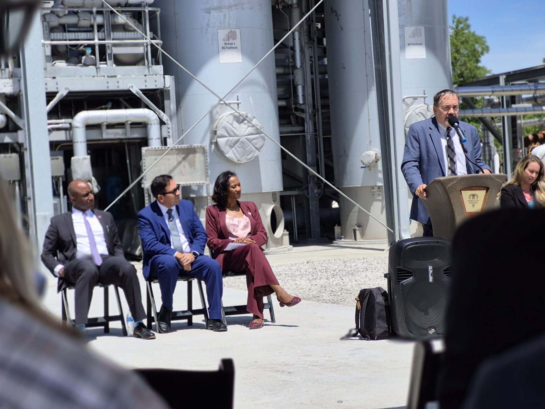 Speaker addressing attendees at a treatment facility
