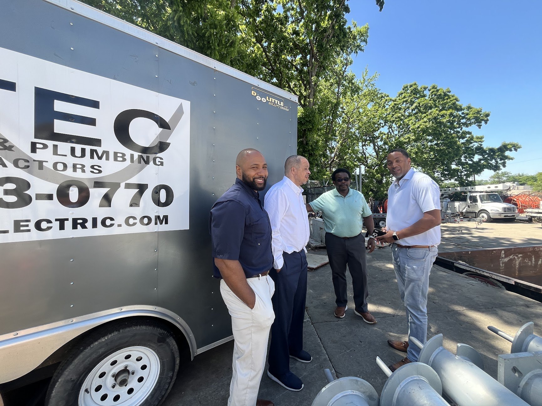 WITEC team beside the company trailer during a site visit